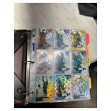 Assorted basketball trading cards in binder