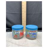 pair of glass jars with blue lids floral pattern