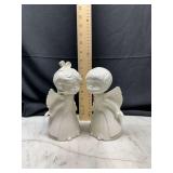 Pair of white ceramic kissing angel figurines