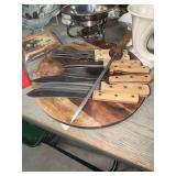 Knives and sharpener on wood lazy Susan