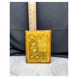 decorative wooden wall plaque with floral motif and verse