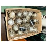 Box of glass spice jars with labels