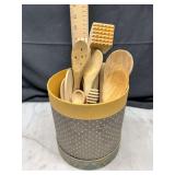 Set of wooden kitchen utensils in holder