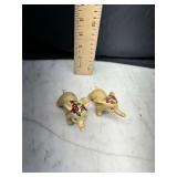 Pair of ceramic elephant figurines with rose floral headpieces
