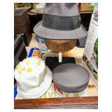 Assorted Hats Collection Including Grey Fedora and Floral Hat