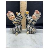 Pair of vintage midcentury Ucagco black and white stripe child figural candle holders one has been repaired see pictures