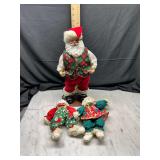 Animated Santa Claus Figure with Two Plush Holiday Dolls