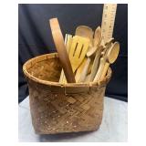 Wooden kitchen utensils in basket