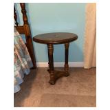 Wooden round side table with turned legs