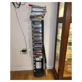 Black metal media tower with assorted media