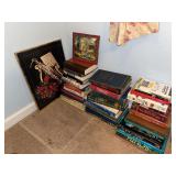 Assorted books and framed saxophonist print
