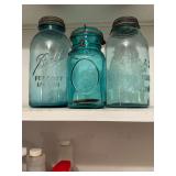 3 blue fruit jars
