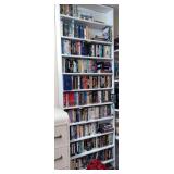 Collection of VHS on left shelf