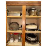Contents of cabinet right of stove-bake ware, george foreman grill