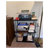 shelf with books, games and Sony boombox