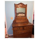 Oak dresser with mirror and carved crest