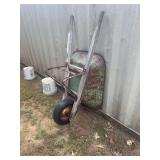 Wooden wheelbarrow with metal tray and rubber tire