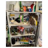 Shelf in utility room with assorted household items