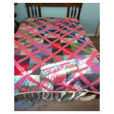 homemade pink lattice pieced quilt