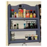 Vintage blue spice rack with bottles
