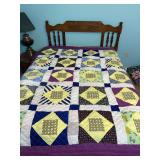 Home made patchwork quilt blue yellow and purple