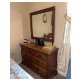 wooden dresser with attached mirror