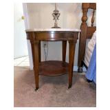 Round wooden end table with marble top