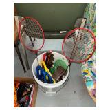 Bucket with badminton rackets, horse shoe game