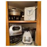 Small kitchen Appliances and Bakeware inside corner cabinet- blender, toaster, hand mixer, can opener