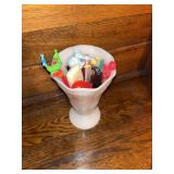 Milk glass vase with assorted desk items