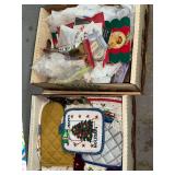 2 boxes oven mitts and doilies, paper goods