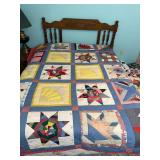 Handmade patchwork quilt with red and blue patterns