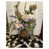 Faux floral arrangement in glass and iron urn style vase