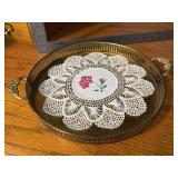 Brass serving tray with crochet and cross stitch doily