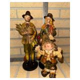 Pair of faux carved Pilgrim Statues and scarecrow