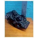 Carved Laughing Buddha lounging in Rocking Chair