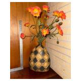 Large checkerboard vase with artificial flowers