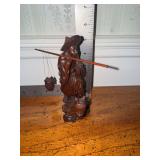 Carved Chinese fisherman