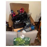 Group of electronics in vintage chair- VCR/DVD, cordless phones, boombox, battery backup surge protector, hand held vacuum
