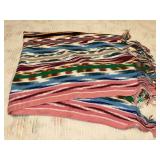 Striped crochet afghan with long fringe