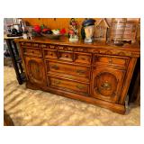 Traditional Mediterranean style buffet matches China cabinet and table