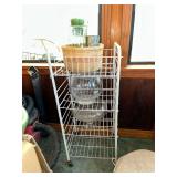 Rolling wire cart with basket of vases, fishbowl and compote