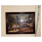 Framed waterfall bridge scene