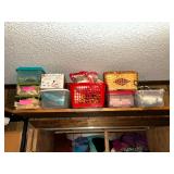 Baskets of sewing supplies and other crafting items above craft room closet