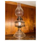Oil lamp with embossed scroll base