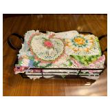 Metal basket of crochet doilies