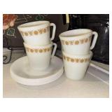 4 pyrex butterfly gold mugs and 6 corelle white saucers