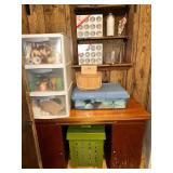 Sewing table with storage containers and sewing and crochet supplies, decor, misc- inside craft room