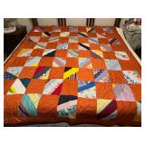 Strip quilt patchwork style with orange stripe backing