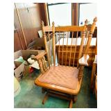 Wooden Spindle Back Glider Rocking Chair with Blue Patterned Cushions
